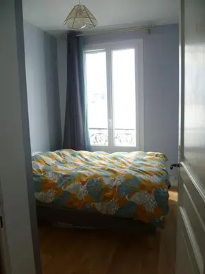 Un ou plusieurs lits dans un hébergement de l'établissement Cocon cosy & calme / Montmartre