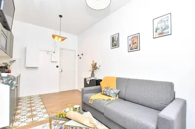 Coin salon dans l'établissement Charming Flat in Montmartre - Imhost