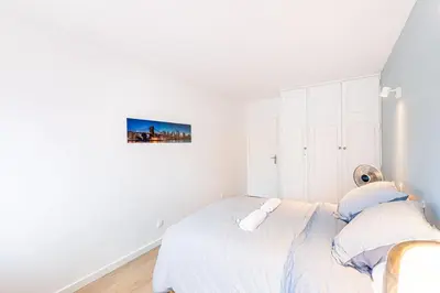 Un ou plusieurs lits dans un hébergement de l'établissement GuestReady - Apt avec Balcon à la Place d'Italie