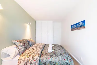 Un ou plusieurs lits dans un hébergement de l'établissement GuestReady - Apt avec Balcon à la Place d'Italie