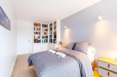 Un ou plusieurs lits dans un hébergement de l'établissement GuestReady - Apt avec Balcon à la Place d'Italie