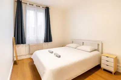 Un ou plusieurs lits dans un hébergement de l'établissement GuestReady - Chic retreat in Clichy