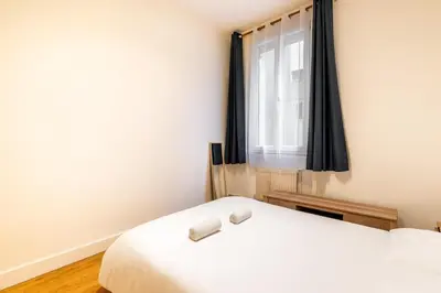 Un ou plusieurs lits dans un hébergement de l'établissement GuestReady - Chic retreat in Clichy