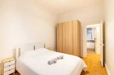 Un ou plusieurs lits dans un hébergement de l'établissement GuestReady - Chic retreat in Clichy