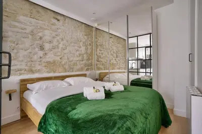 Un ou plusieurs lits dans un hébergement de l'établissement Magnifique appartement proche Tour Eiffel