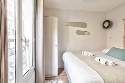 Un ou plusieurs lits dans un hébergement de l'établissement Cozy and practical apt in Paris Center