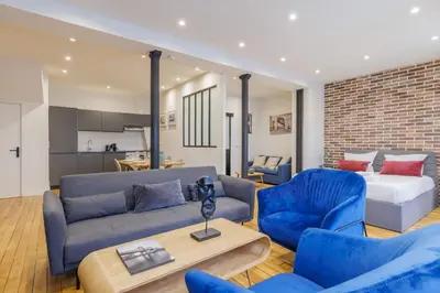 Coin salon dans l'établissement Amazing apartment 2BR6P - BastilleVoltaire