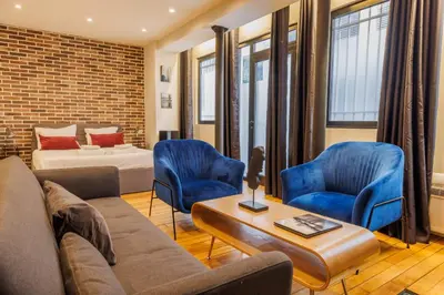 Coin salon dans l'établissement Amazing apartment 2BR6P - BastilleVoltaire