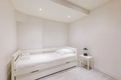 Un ou plusieurs lits dans un hébergement de l'établissement Amazing apartment 2BR6P - BastilleVoltaire