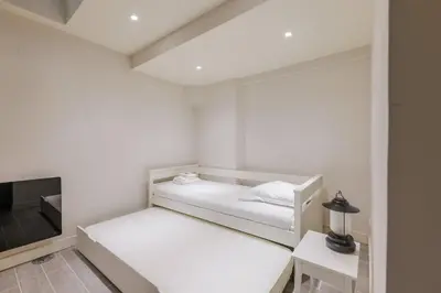 Un ou plusieurs lits dans un hébergement de l'établissement Amazing apartment 2BR6P - BastilleVoltaire