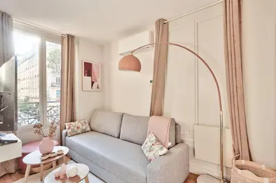 Coin salon dans l'établissement Cozy Apartment Paris Center for 3