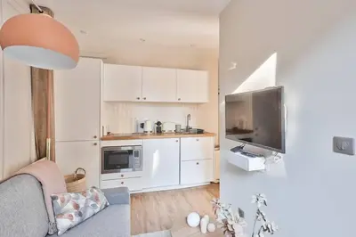 Cuisine ou kitchenette dans l'établissement Cozy Apartment Paris Center for 3