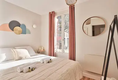 Un ou plusieurs lits dans un hébergement de l'établissement Cozy Apartment Paris Center for 3