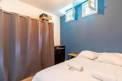 Un ou plusieurs lits dans un hébergement de l'établissement GuestReady - Apt de Charme près de la Tour Eiffel
