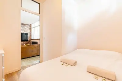Un ou plusieurs lits dans un hébergement de l'établissement GuestReady - Apt de Charme près de la Tour Eiffel