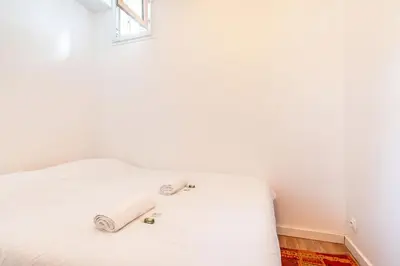 Un ou plusieurs lits dans un hébergement de l'établissement GuestReady - Apt de Charme près de la Tour Eiffel