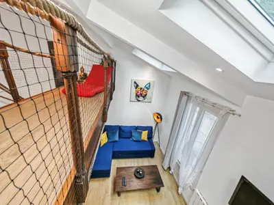 Un ou plusieurs lits dans un hébergement de l'établissement Loft Duplex à 2 min de Paris - Parking gratuit