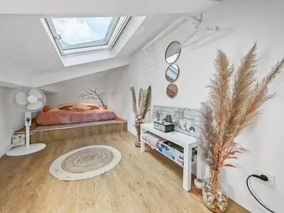 Un ou plusieurs lits dans un hébergement de l'établissement Loft Duplex à 2 min de Paris - Parking gratuit