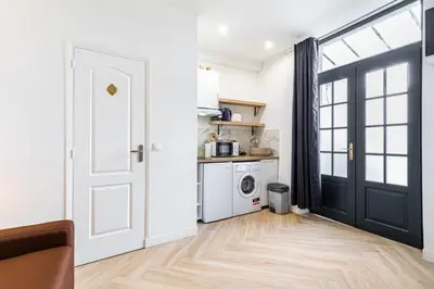 Cuisine ou kitchenette dans l'établissement GuestReady - Charming Getaway in Le Marais