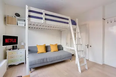 Un ou plusieurs lits dans un hébergement de l'établissement Studio - Appartement Quartier Tour Eiffel 3 Free Netflix