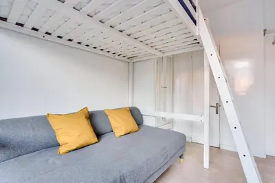 Coin salon dans l'établissement Studio - Appartement Quartier Tour Eiffel 3 Free Netflix
