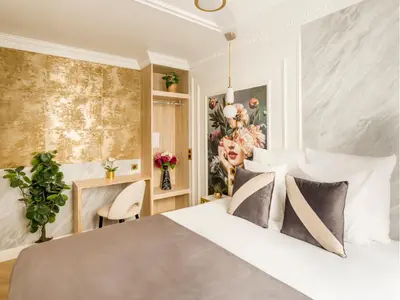Un ou plusieurs lits dans un hébergement de l'établissement Merveil - Luxury Suite - Marais - Poissonniere