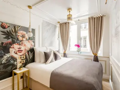Un ou plusieurs lits dans un hébergement de l'établissement Merveil - Luxury Suite - Marais - Poissonniere