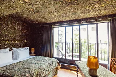 Un ou plusieurs lits dans un hébergement de l'établissement Hôtel Eldorado Paris