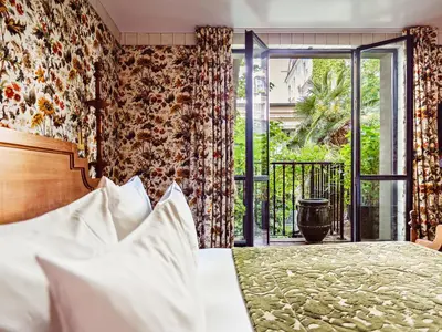 Un ou plusieurs lits dans un hébergement de l'établissement Hôtel Eldorado Paris