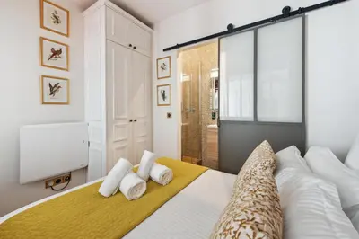 Un ou plusieurs lits dans un hébergement de l'établissement La Maison Kléber - Luxury apartments, Eiffel Tower - Champs-Elysées