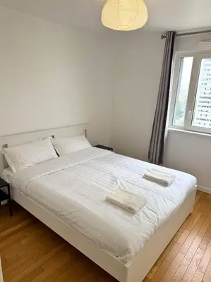 Un ou plusieurs lits dans un hébergement de l'établissement Magnifique Appart. spacieux 8P/ Défense-Courbevoie
