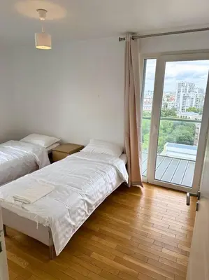 Un ou plusieurs lits dans un hébergement de l'établissement Magnifique Appart. spacieux 8P/ Défense-Courbevoie