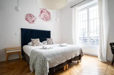 Un ou plusieurs lits dans un hébergement de l'établissement GuestReady - A classic touch of Parisian glamour