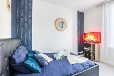 Un ou plusieurs lits dans un hébergement de l'établissement Appartement Moderne, proche Porte de Versailles et Gare de Clamart