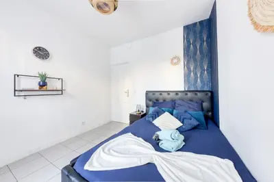 Un ou plusieurs lits dans un hébergement de l'établissement Appartement Moderne, proche Porte de Versailles et Gare de Clamart