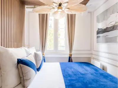 Un ou plusieurs lits dans un hébergement de l'établissement Merveil - Luxury Suite - Notre Dame - Monge