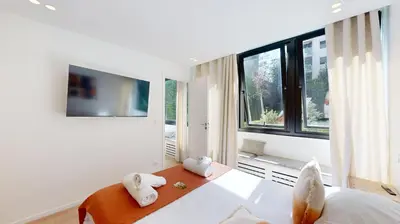 Un ou plusieurs lits dans un hébergement de l'établissement 311 Suite Elisa - Superbe Appartement à Paris.