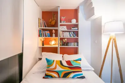 Un ou plusieurs lits dans un hébergement de l'établissement Spacious Family Apartment near Bastille & Marais