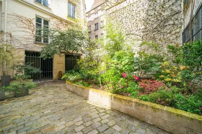 Jardin de l'établissement Charming Garden Apartment in Le Marais