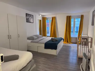 Un ou plusieurs lits dans un hébergement de l'établissement Central Flat for 7