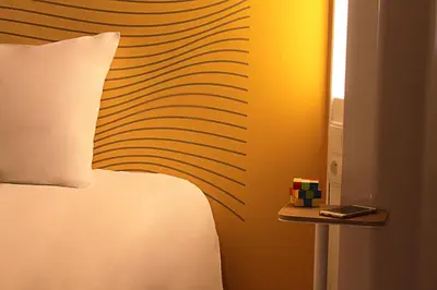 Un ou plusieurs lits dans un hébergement de l'établissement B&B HOTEL Paris Porte des Lilas