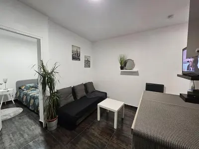 Coin salon dans l'établissement Appartement Proche Metro Paris