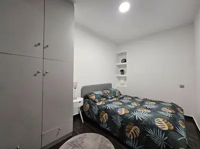 Un ou plusieurs lits dans un hébergement de l'établissement Appartement Proche Metro Paris
