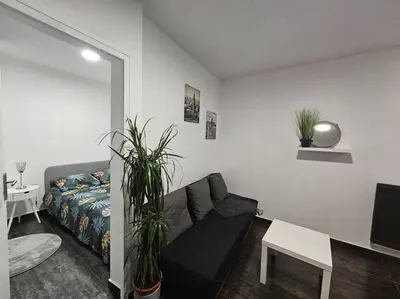 Coin salon dans l'établissement Appartement Proche Metro Paris