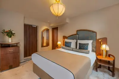 Un ou plusieurs lits dans un hébergement de l'établissement Hôtel La Bourdonnais by Inwood Hotels