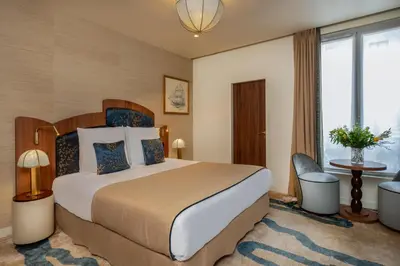 Un ou plusieurs lits dans un hébergement de l'établissement Hôtel La Bourdonnais by Inwood Hotels