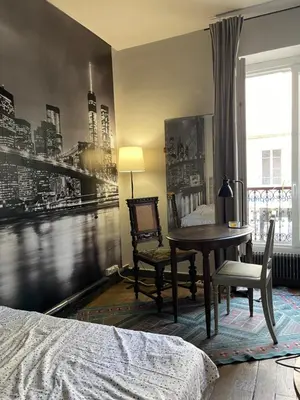 Un ou plusieurs lits dans un hébergement de l'établissement Cosy Nest in Montmartre