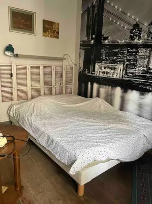 Un ou plusieurs lits dans un hébergement de l'établissement Cosy Nest in Montmartre
