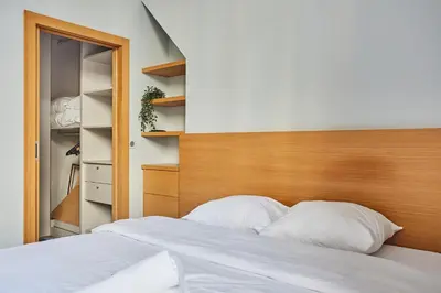 Un ou plusieurs lits dans un hébergement de l'établissement Apartment Ile Saint Louis by Studio prestige