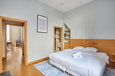 Un ou plusieurs lits dans un hébergement de l'établissement Apartment Ile Saint Louis by Studio prestige